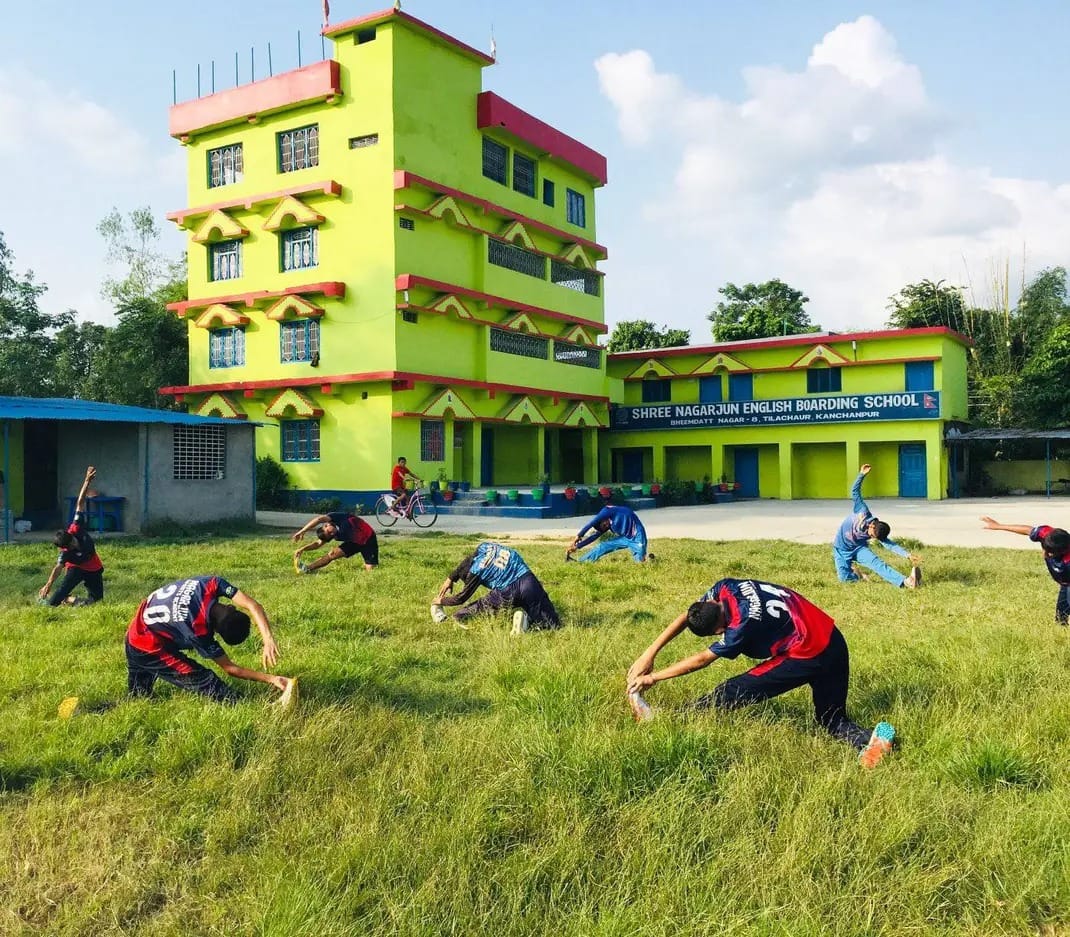 Students taking part in outdoor activity in front of Shree Nagarjun English Boarding School, Tilachaur, Mahendranagar